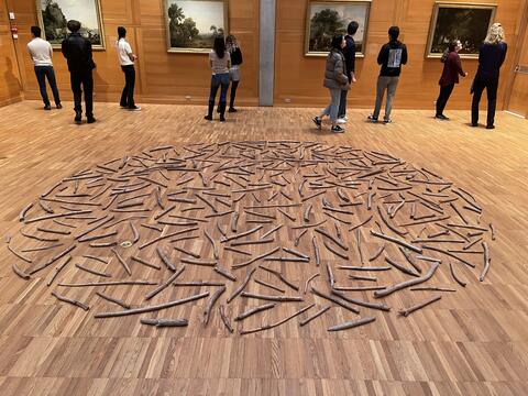 Segment of tour in the YCBA's Library Court with installation of Richard Long's Quantock Wood Circle (1981)